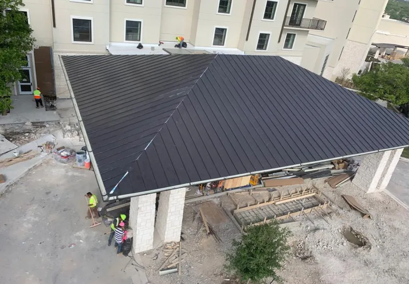 Metal roofing installation team working on a commercial building in Citrus Park