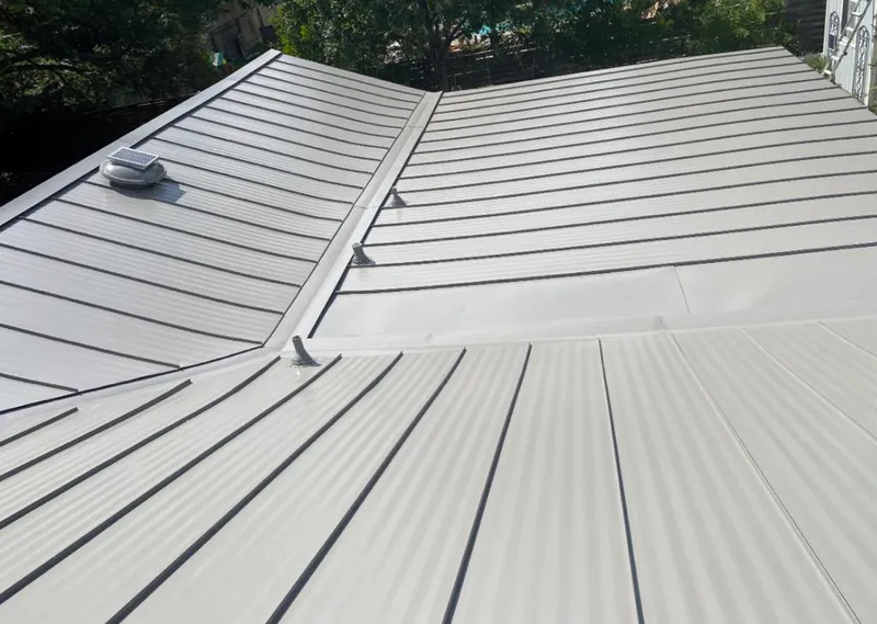 Solar attic fan installed on a metal roof for Roof Ventilation in Citrus Park